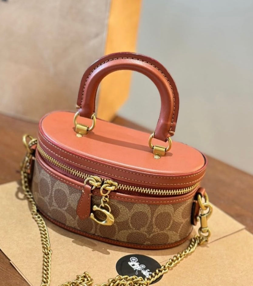 Round Handbag with Chain and Elegant Handle